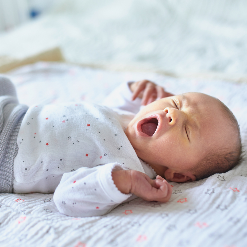 Yawning baby who is catnapping